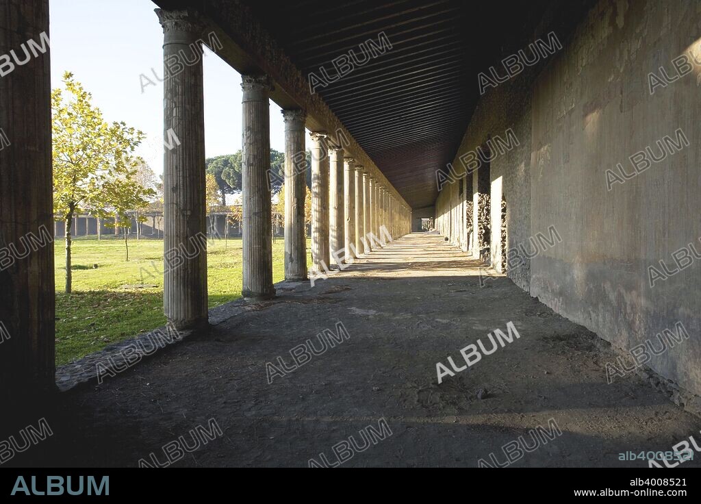 The palaestra in Pompeii, Italy. A palaestra was an ancient Greek wrestling school. The events that did not require a lot of space, such as boxing and wrestling, were practiced there. The palaestra functioned both independently and as a part of public gymnasia. A palaestra could exist without a gymnasium, but no gymnasium could exist without a palaestra. Pompeii is a ruined and partially buried Roman town-city near modern Naples in the Italian region of Campania, in the territory of the comune of Pompei. Along with Herculaneum, its sister city, Pompeii was destroyed, and completely buried, during a long catastrophic eruption of the volcano Mount Vesuvius spanning two days in 79 AD.
