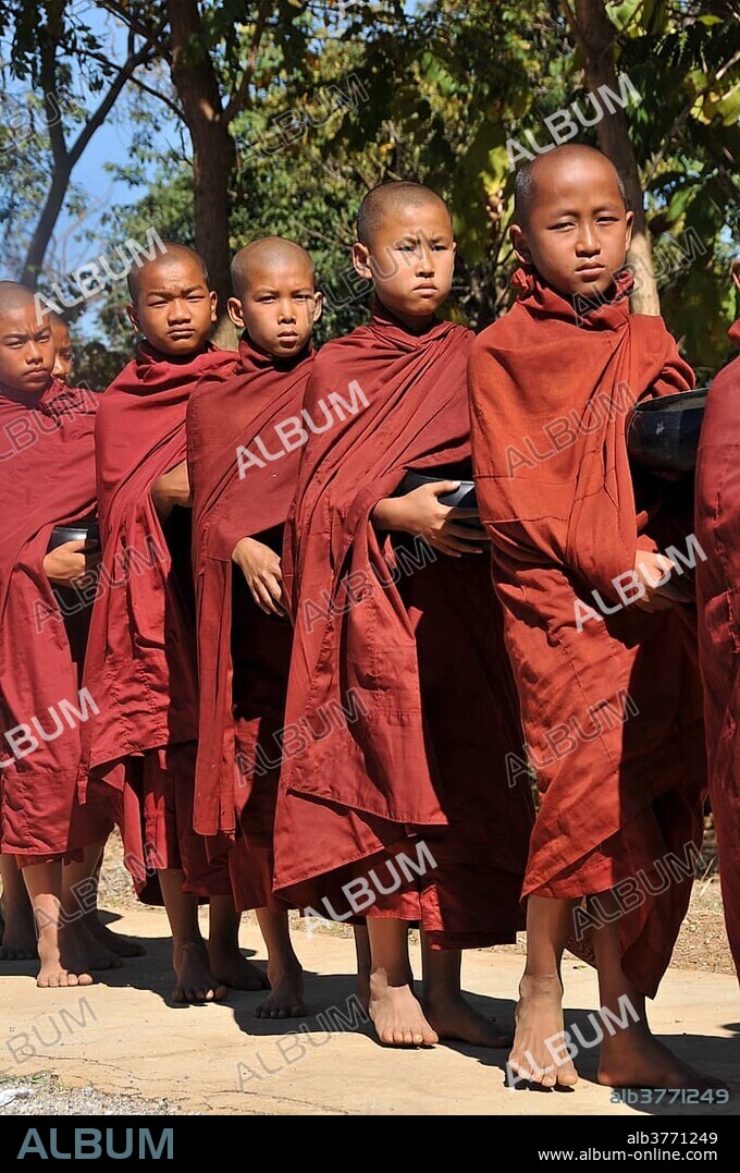 Buddhist monks collecting alms in, Full Moon Festival in December, Nyaung Shwe, Shan State, Myanmar, Burma, Asia.
