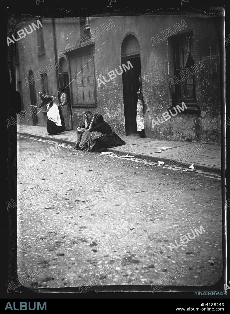 Mary Ann Street, Cardiff, 1893. Women taking a break from their  domestic duties in Mary Ann Street, Cardiff, 1893.