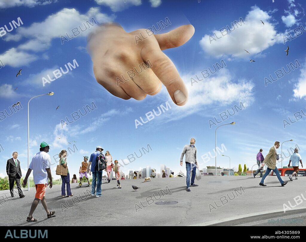 Large hand in sky pointing to man standing out from the crowd.