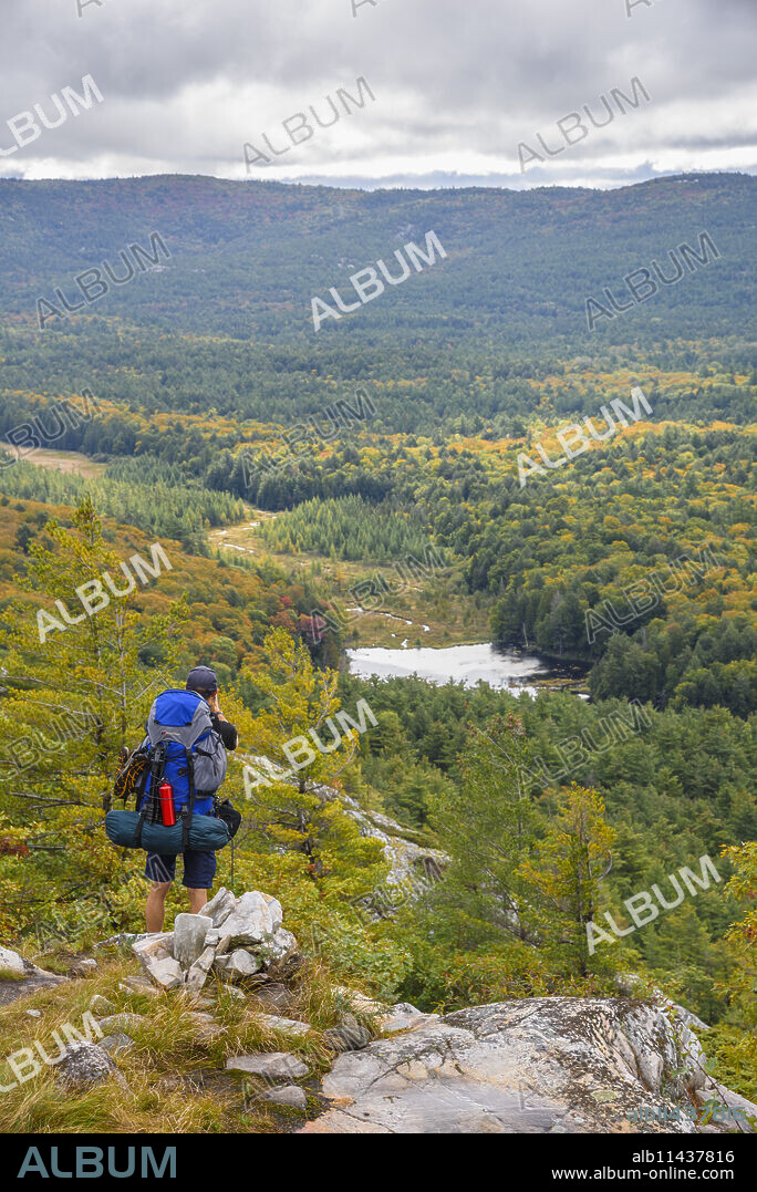 Hiker on La Cloche Silhouette Trail in Killarney Provincial Park, Ontario, Canada, North America.
