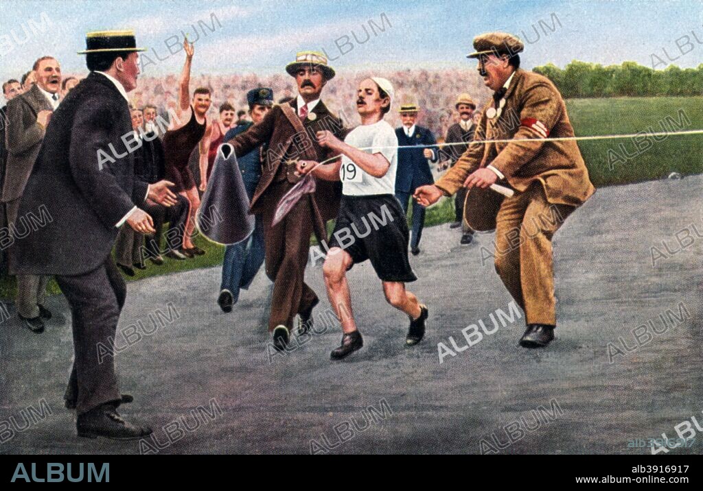 Dorando Pietri finishing the first modern Olympic marathon, London, 1908. The marathon at the London Olympics of 1908 was run in ususually hot conditions. Italian athlete Dorando Pietro arrived at the stadium alone in the lead but, suffering from exhaustion and dehydration, he collapsed on the track in a state of disorientation. Officials helped him up and pointed him towards the finishing line which, after falling four more times, he eventually crossed in first place. The last 350 metres of the race had taken him 10 minutes to complete. The American athlete Johnny Hayes finished second and the US team registered a protest at the assistance Pietri had received from the officials. Their protest was upheld and the Italian was disqualified. A print from Olympia 1936, Die Olympischen Spiele 1936, Volume I, Cigaretten-Bilderdienst, Hamburg, 1936.