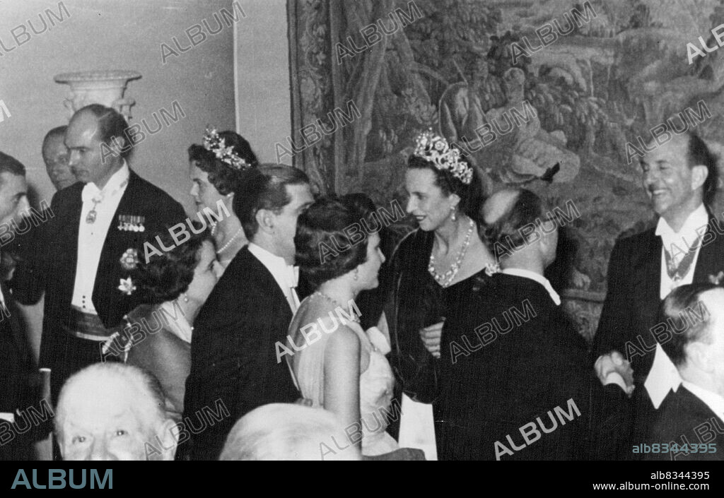 Royal Reception.Photo Shows. The reception for the wedding given by the Bride's Father... seen (right) receiving his guests together with (left to right) Prince Alexander, Princess Maria Jose.Princess Maria Pia, Daughter of ex-King Umberto of Italy, Marries Prince Alexander of Yugoslavia in Estoril, Portugal, today. February 12, 1955. (Photo by Paul Popper, Paul Popper Ltd.).