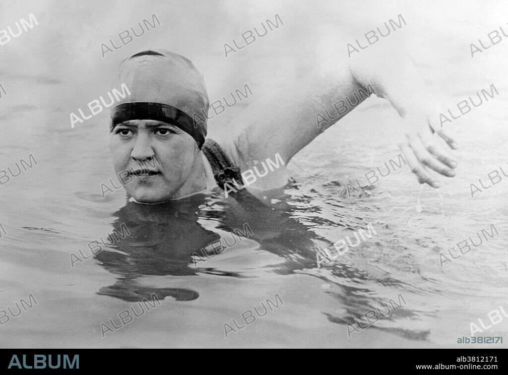 Gertrude Caroline Ederle (October 23, 1905 - November 30, 2003) was an American competition swimmer, Olympic champion, and former world record-holder in five events. At the 1924 Summer Olympics in Paris, she won a gold medal as a member of the first place U.S. team in the 4-100 meter freestyle relay. Individually, she received bronze medals for finishing third in the women's 100-meter freestyle and women's 400-meter freestyle races. In 1925, Ederle turned professional and swam the 22 miles from Battery Park to Sandy Hook in 7 hours and 11 minutes, a record time which stood for 81 years. In 1926, she became the first woman to swim across the English Channel. When she returned home, she was greeted with a ticker-tape parade in NYC where more than 2 million people lined the streets to cheer her. A fall down the steps of her apartment building in 1933 twisted her spine and left her bedridden for several years, but she recovered well enough to appear at the 1939 New York World's Fair. She never married and died in 2003 at the age of 98. Photographed by Bain News Service, undated.