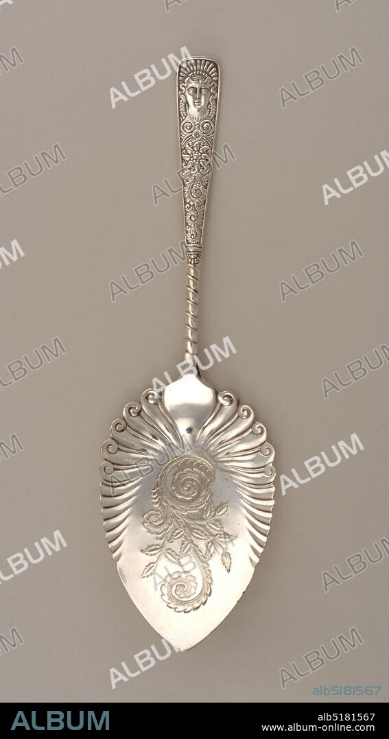 'Assyrian Head' pattern, Meriden Silver Plate Company, 18691898, silver plate, Handle with scrolled foliate ornament and antique style crowned female mask at tip; spade-shaped blade with scrolled foliate decoration, partially fluted., 188586, cutlery, Decorative Arts, server, server.