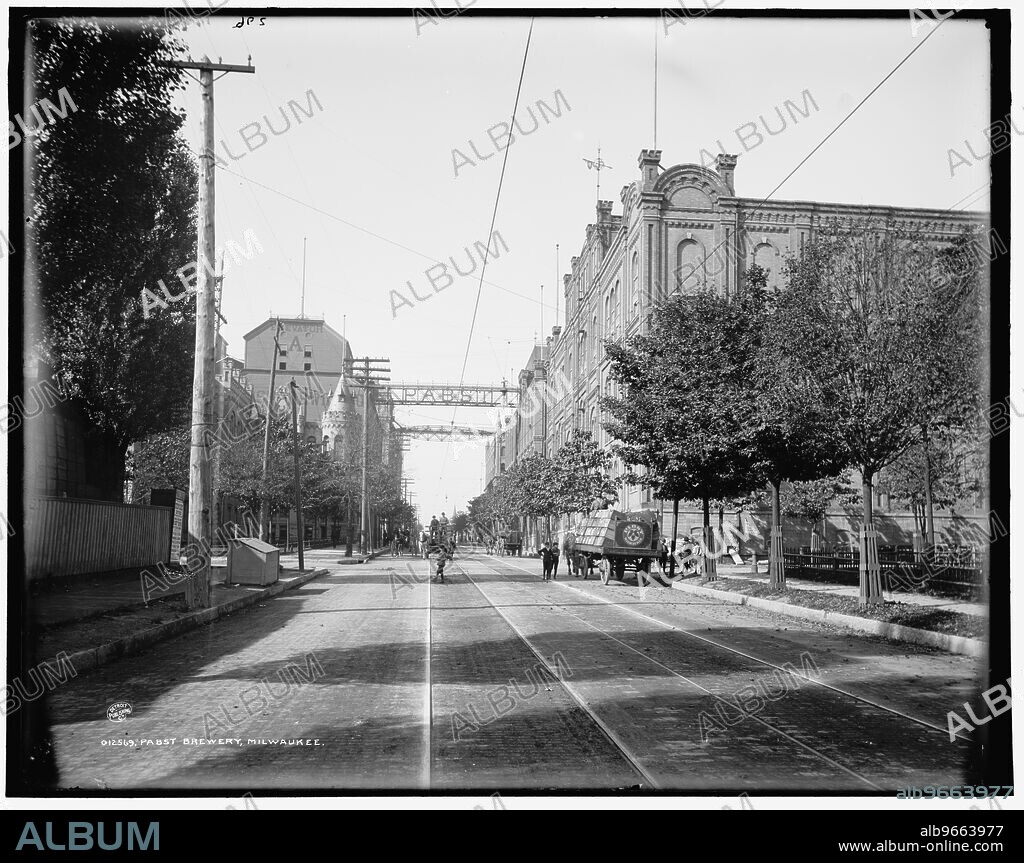 Pabst Brewery, Milwaukee, between 1890 and 1901. Note grain elevator on left and delivery cart piled with crates of beer on right.