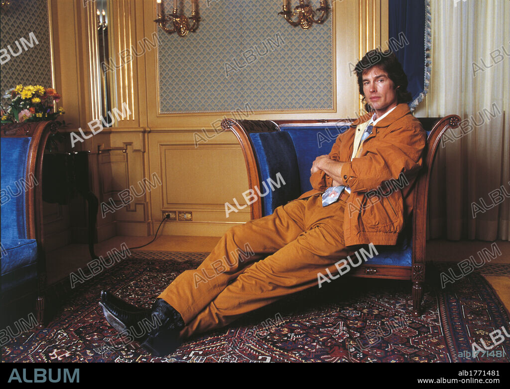 Ronn Moss sitting in the armchair. American actor Ronn Moss sitting in the armchair. 1990s.
