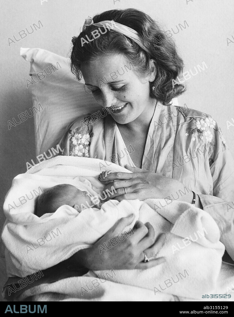 Honolulu, Hawaii:   June 15, 1932 Newly born Marylyn Hauoli Thorpe keeps a tight grip on her mother, who is well known as Mary Astor in the movies.