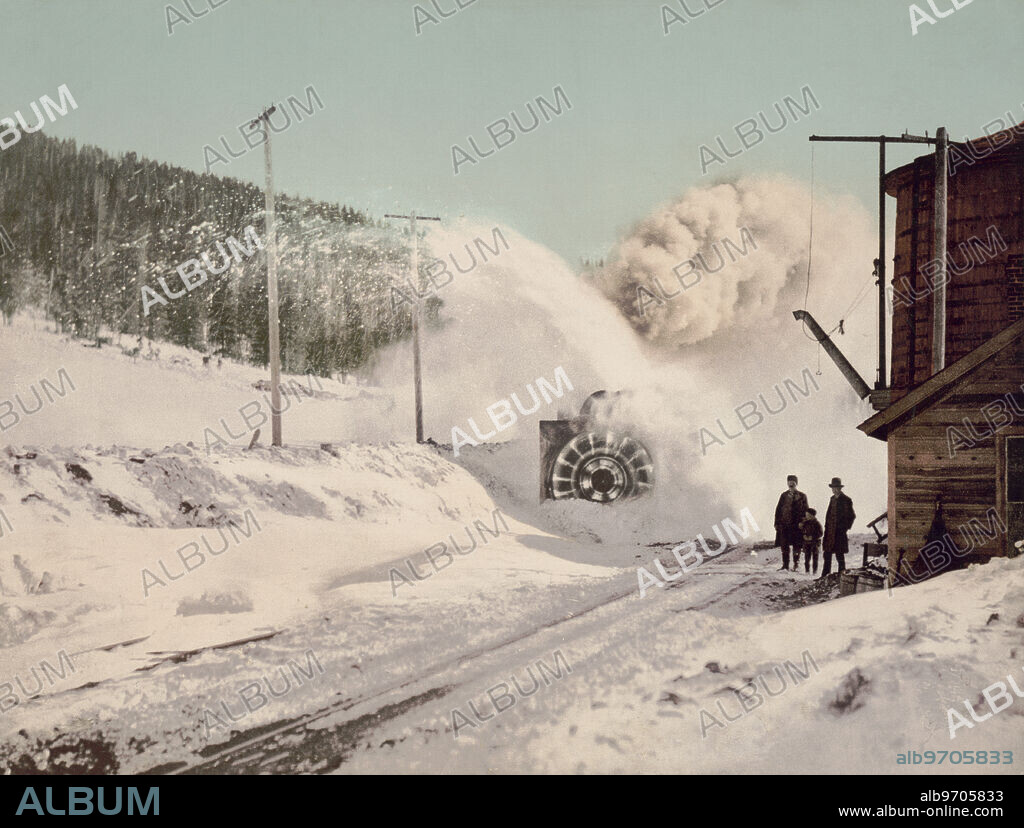 Colorado Midland Railway Train with Rotary Snow Plow Removing Snow from Tracks next to Water Tower, Hagerman Pass, Colorado, USA, William Henry Jackson for Detroit Publishing Company, 1899.