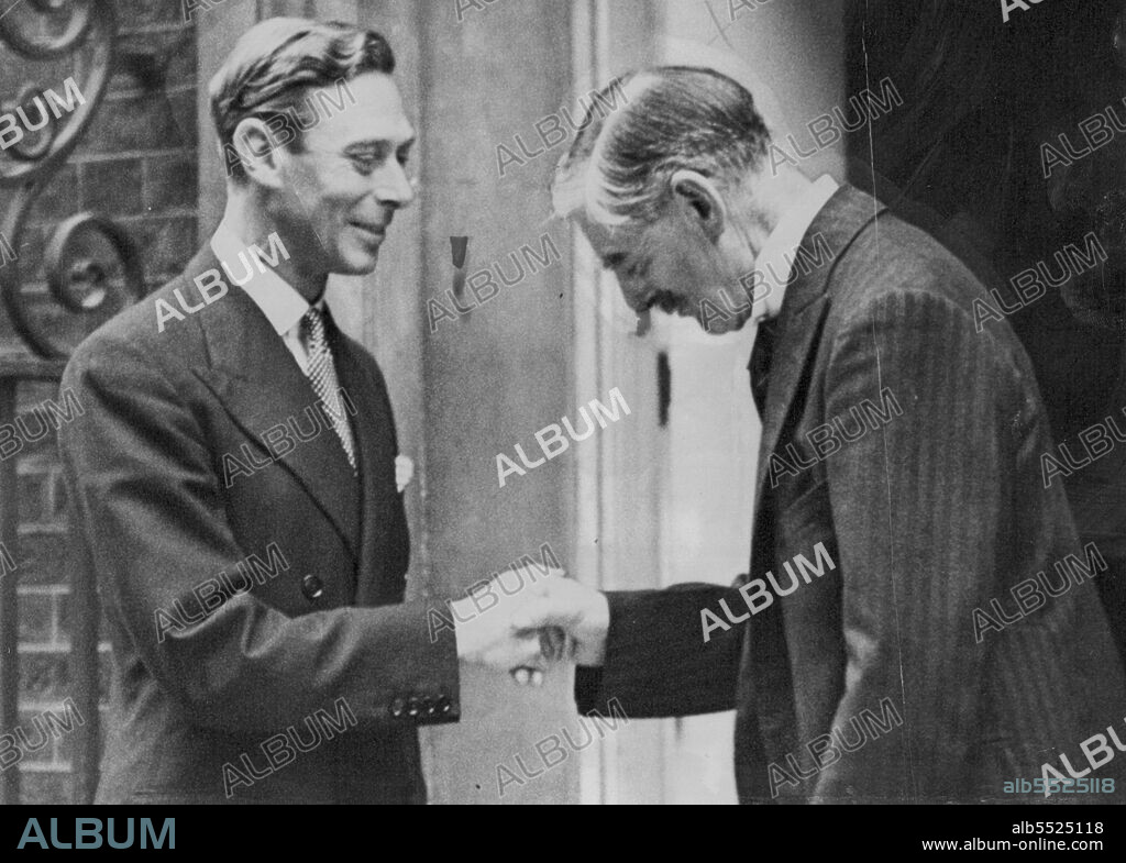 The King Shakes Hands With Premier As His Majesty Leaves no.10: The King shakes hands with Mr.Chamberlain as His Majesty left 10, Downing Street after his call there this afternoon, September 1. The King suggested that he should go to Downing Street to see Mr.Chamberlain this afternoon to save the premier the trouble of driving to and from the palace. October 05, 1939. (Photo by The Associated Press of Great Britain Ltd.).