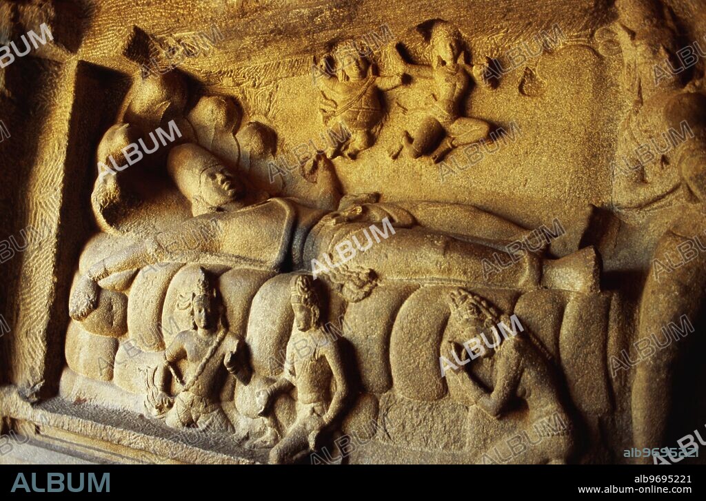 Lord Vishnu reclining on his serpent couch in Cave at Mahishasura mardini Mandapam - Mahabalipuram Mamallapuram Tamil Nadu - India.