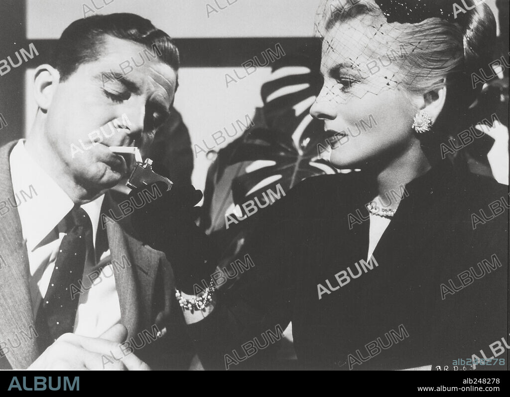 DANA ANDREWS und JOAN FONTAINE in BEYOND A REASONABLE DOUBT, 1956, unter der Regie von FRITZ LANG. Copyright RKO.