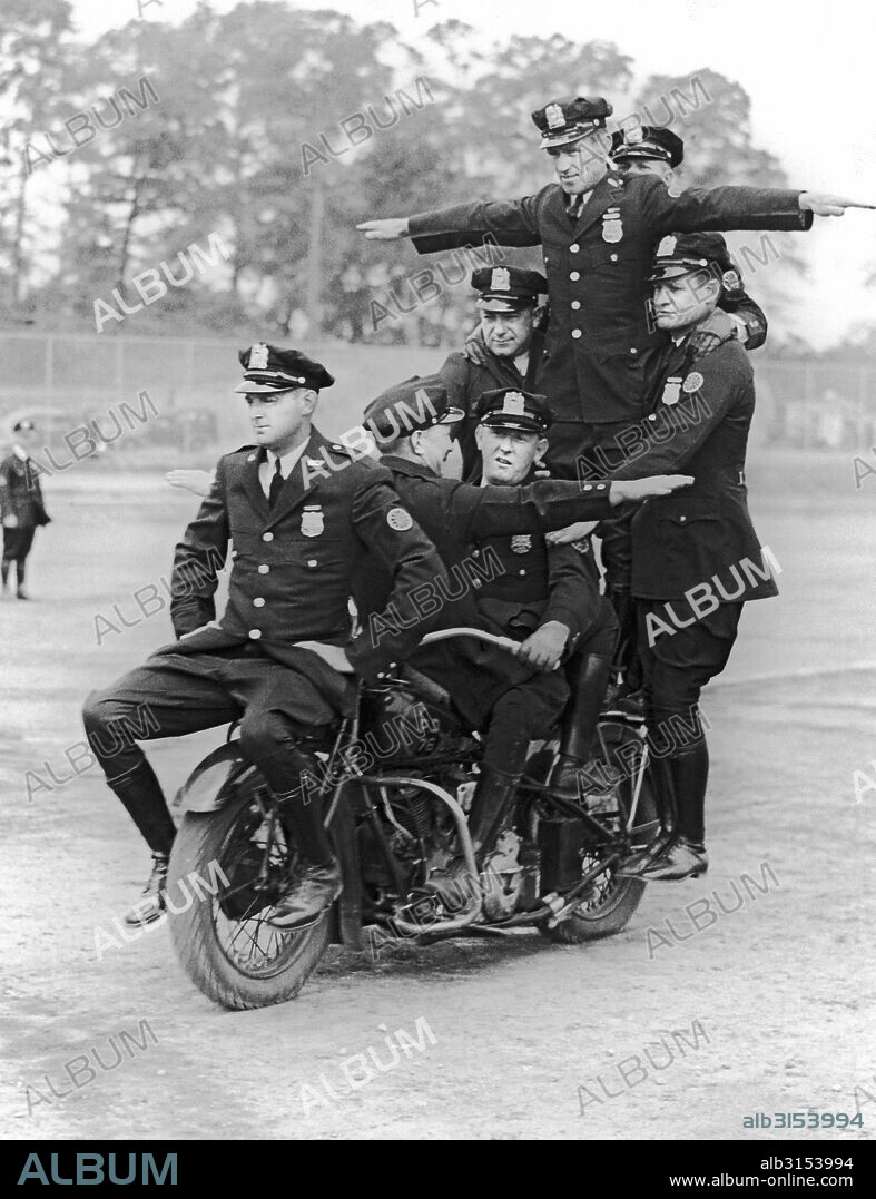 New York, New York:  c. 1937 Members of the New York City Police motorcycle division practice their routines for the upcoming benefit show at Madison Square Garden for the Police Activities League.