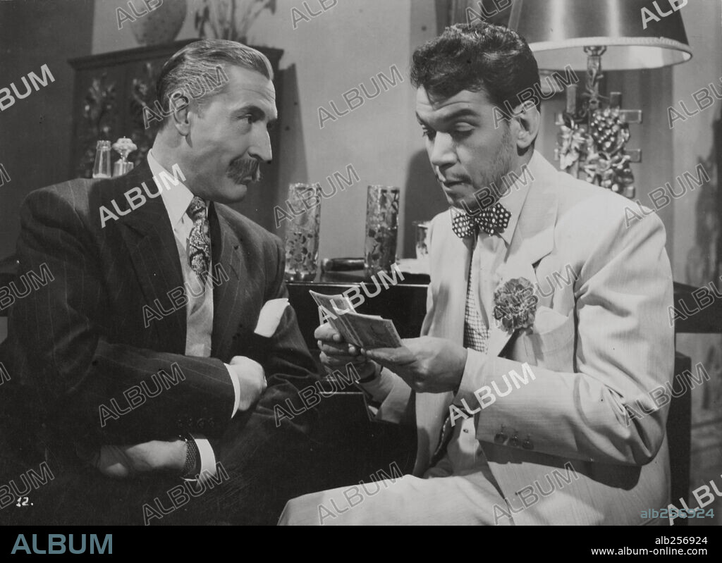 ANGEL GARASA and CANTINFLAS in CABALLERO A LA MEDIDA, 1954, directed by MIGUEL M. DELGADO. Copyright POSA FILMS, S.A.
