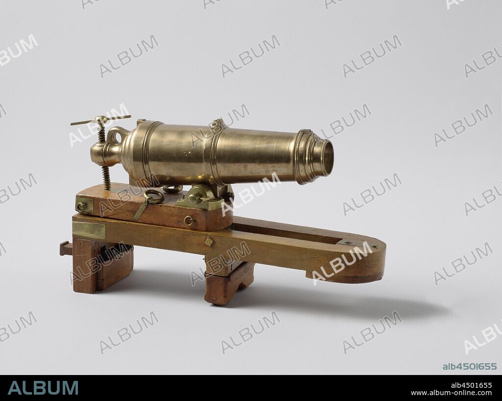 Model of an 18-Pounder Carronade on a Slide, Model of a carronade on sliding carriage, incomplete. The carronade has a caliber of 2.6 cm. The barrel has a slot elevation with a visor, a visor on the middle decorative band and a front band, a refraction ring and a feather screw through the grape. The upper carriage has a light trapezoidal body with brass fittings and rings, the front and back are rounded. Against the back the box in brass fitting, on top a brass plate to support the elving screw and at the front the ears through which the tapas runs, the vertebral bolt is missing. The lower carriage consists of a wooden frame with brass fittings, which tapers slightly forward and is rounded off at the front, Slightly to the rear, a securing plate is fitted on the underside, with which the carriage is secured against the ship's wall in the longitudinal direction. In this part the hole for the spindle bolt is made in the gate threshold, the gate threshold is missing. The frame rests on two bobbins, one in the middle and one at the rear, which is composed of two vertical corner posts with horizontal blocks in between. The lower two blocks include two wooden marbles that protrude below, these blocks can be moved vertically with two keys, so that in the lower position the rear of the carriage comes to rest on the marbles and is therefore easily movable. In the upper position, the blocks are secured by a hook. The middle block has two wheels at the bottom and can also be lowered so that the carriage rests on it. Between the beams in the longitudinal direction two spring blades are arranged, which narrow towards the rear to deplete the recule by clamping the vertebral bolt between them. A box is fitted at the rear of the frame., anonymous, Netherlands, 1785 - 1820, wood (plant material), brass (alloy), h 18.7 cm × w 34 cm × d 9.5 cm × h 16 cm w 45.5 cm × d 32 cm.