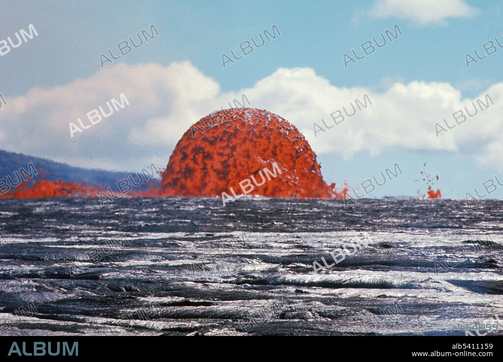 Dome fountain from the Mauna Ulu eruption of Kilauea, on October 11, 1969. This dome fountain is about 20m (65ft) high. Symmetrical dome fountains are rare. Mauna Ulu, on the eastern flank of Kilauea, erupted in phases from 1969 until 1974.