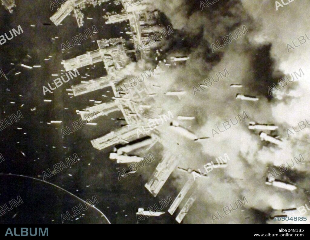 The Japanese port of Kobe is bombed by US aircraft in March 1945.