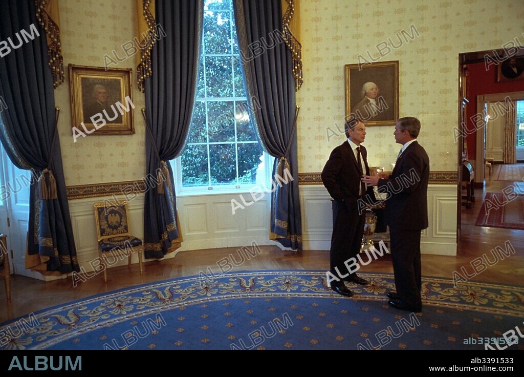 United States President meets with British Prime Minister Tony Blair in the Blue Room of the White House following the 911 terrorist attacks, Washington DC, September 20, 2001.