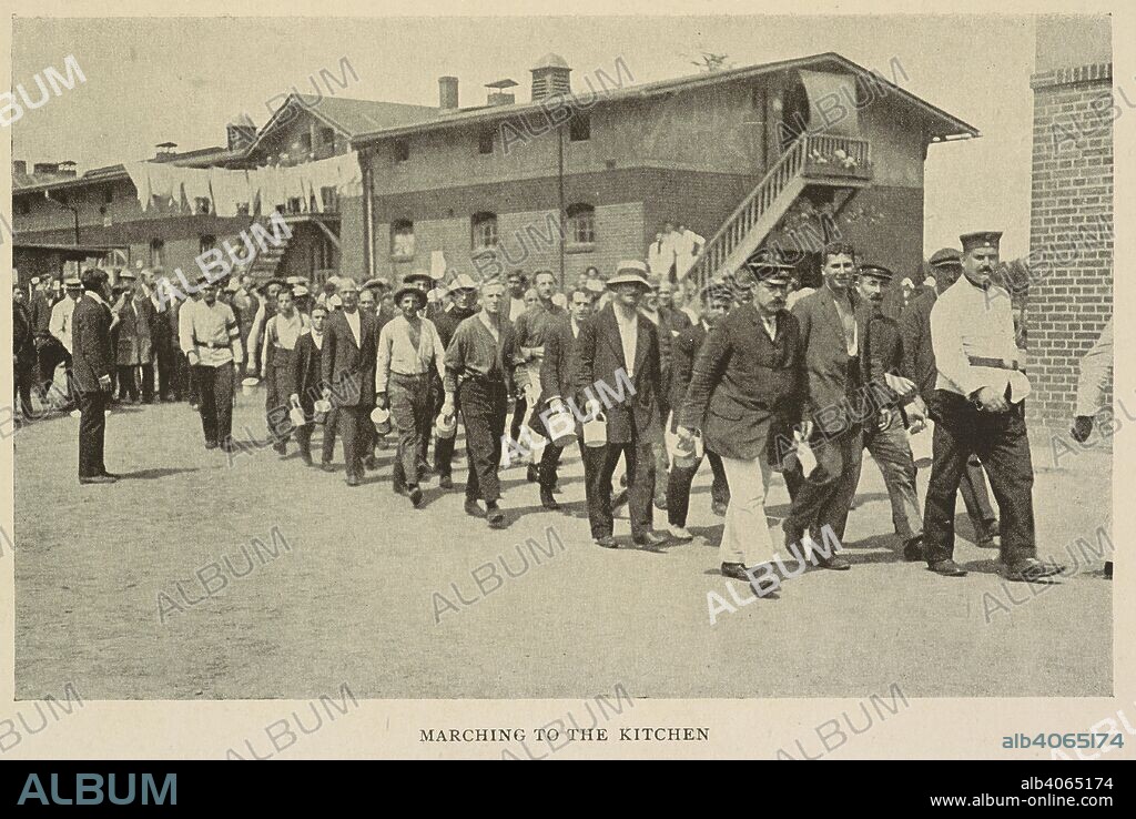 ISRAEL COHEN. 'Marching to the kitchen'. Civilian prisoners of Ruhleben internment camp, a civilian detention camp during the First World War. The camp was originally a harness racing track. The Ruhleben Prison Camp: a record of nineteen months' internment ... With twenty-six illustrations and a plan. London : Methuen & Co., 1917. Source: 9083.f.32 plate opposite page 280.