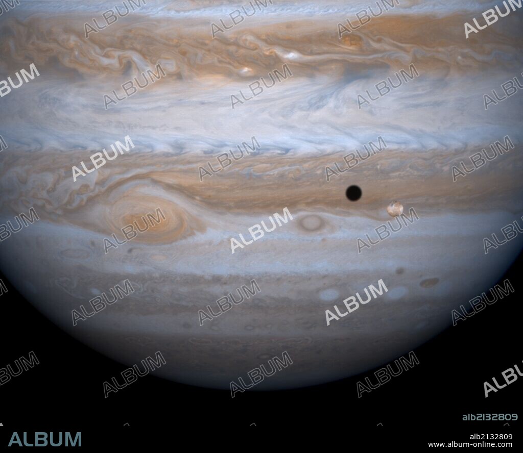 Jupiter and it's largest satellite, Io. Cassini Spacecraft. (Photo by: Universal History Archive/UIG via Getty Images).