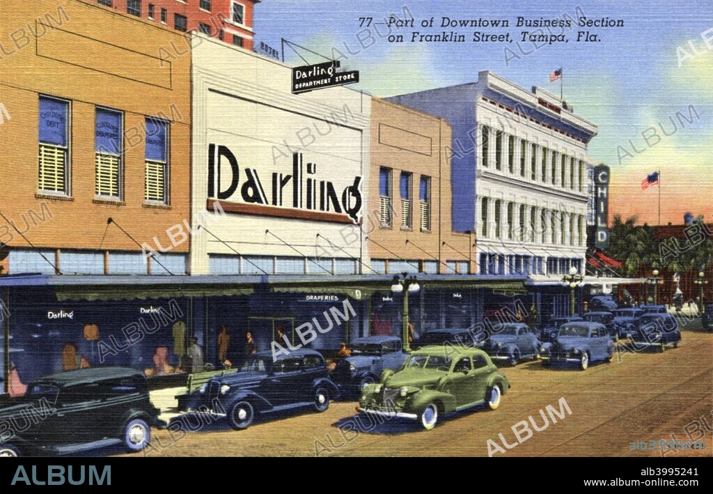 Part of the downtown business district, Franklin Street, Tampa, Florida, USA, 1940. Postcard. Street scene showing the Darling Department Store and cars on the street.