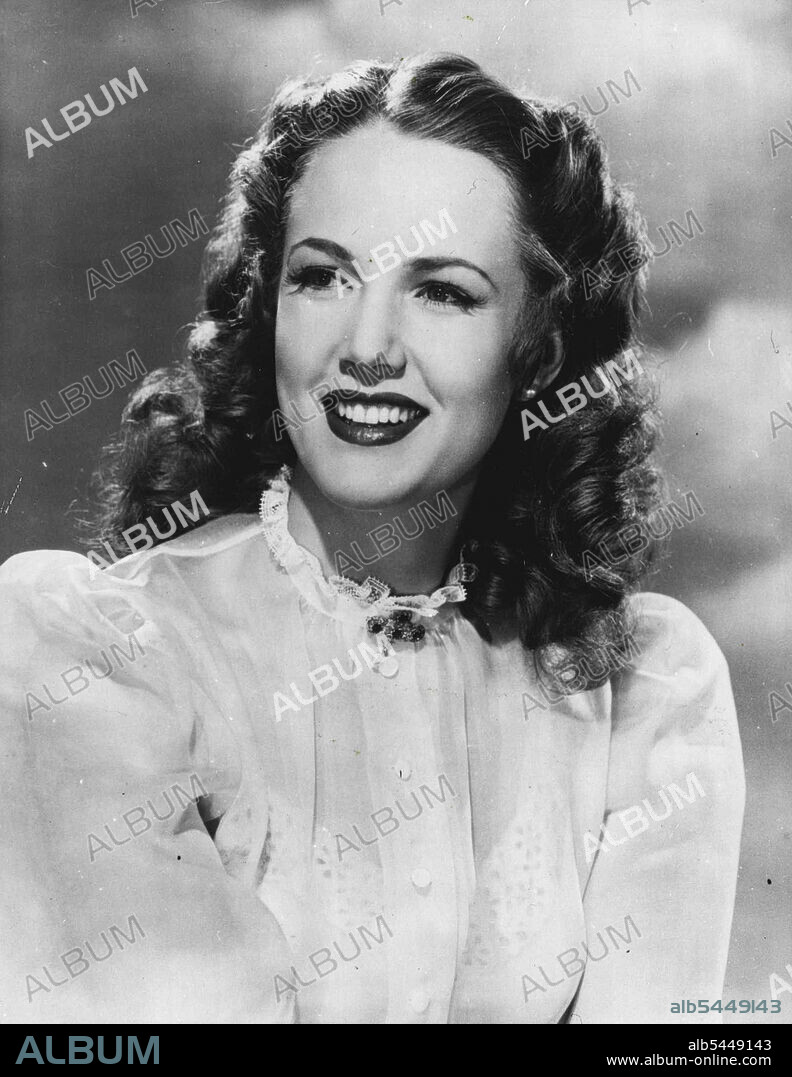 Subtle Revelation Alluring actress Barbara Britton posed for this charming outdoor photograph, between scenes from her latest Columbia picture the untamed breed. Mother may know best about some thing, but when a girl wants to discuss the clothes question today, she goes to grandmother for enlightenment. On this occasion grandma revealed that Barbara's white organdie blouse was just what she wore way back in 1900, and the full sleeves and lace edged collar make it just as attractive today. Admittedly Barbara's is a little more seductive and the very simplicity is belied (yet enhanced) by her slip trimmed with eyelet embroidery. Any girl can copy this fashion. and also search antique shops for an intriguing gold filigree brooch set with ***** like Barbara's wearing. November 26, 1948. (Photo by Reuterphoto).