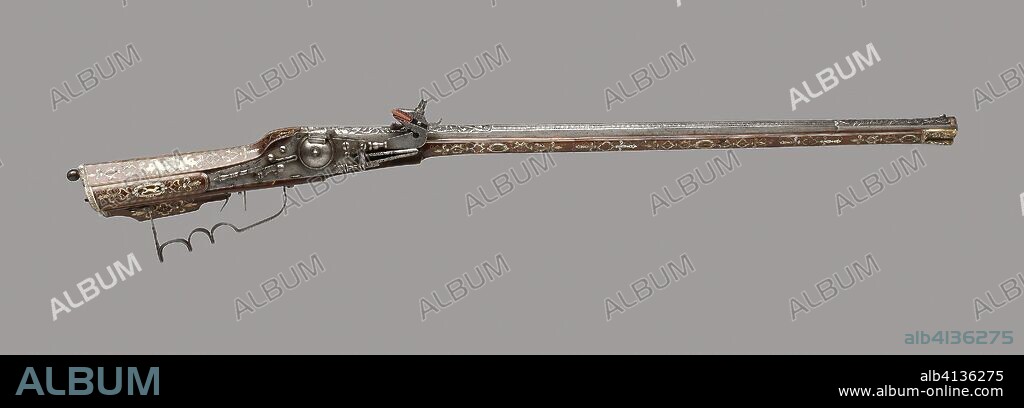 Wheellock Rifle. German. Date: 1595. Dimensions: L. 104 cm (41 in.)
Barrel L. 72.3 cm (29 7/16 in.)
Caliber .50
Wt. 6 lb. 15 oz. Iron, brass, walnut, horn, and mother-of-pearl. Origin: Germany.