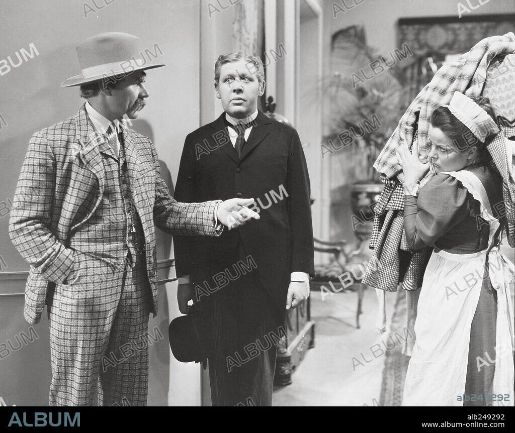 CHARLES LAUGHTON and CHARLES RUGGLES in RUGGLES OF RED GAP, 1935, directed by LEO MCCAREY. Copyright PARAMOUNT PICTURES.