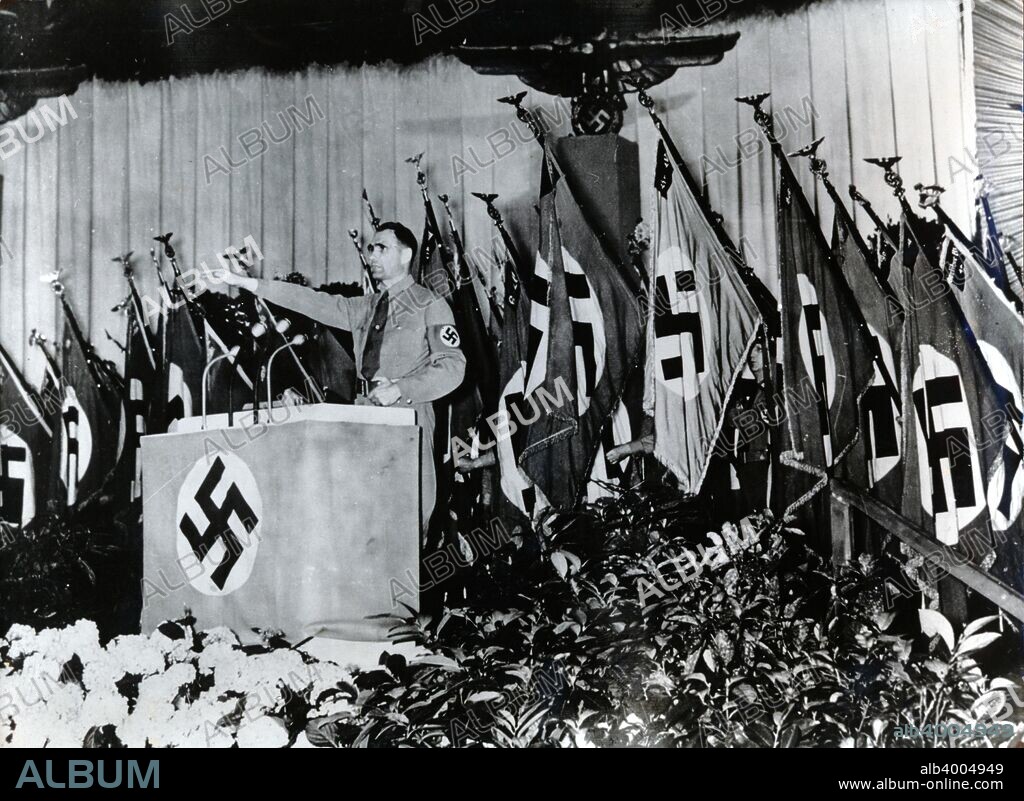 Rudolf Hess, Nazi deputy leader, speaking at the Sportpalast, Berlin, 1939. Hess (1894-1987) was appointed Adolf Hitler's deputy shortly after the Nazis came to power in 1933. In 1941, just before the German invasion of the Soviet Union, he flew to Scotland, ostensibly to begin peace negotiations with the British government, but was arrested and spent the rest of the war as a POW. Found guilty of war crimes at the Nuremberg Trials in 1946, Hess spent the rest of his life in Spandau Prison in Berlin.