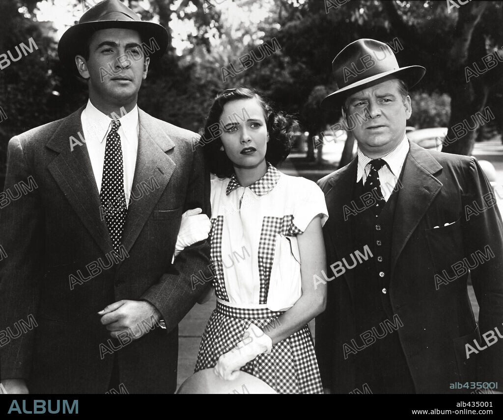 MACDONALD CAREY, TERESA WRIGHT and WALLACE FORD in SHADOW OF A DOUBT, 1943, directed by ALFRED HITCHCOCK. Copyright UNIVERSAL PICTURES.