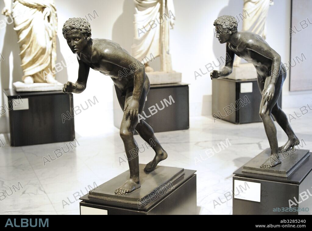 Statues of runners. 1st century AD. Bronze. Probably a Roman copy of a Greek original from the 4th-3rd centuries BC. Great peristyle. Villa of the Papyri, Herculaneum. National Archaeological Museum. Naples. Italy.