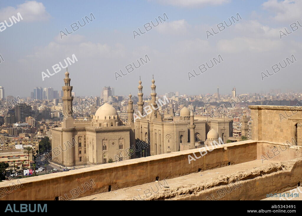 Al Rifa'i Mosque (right) and Mosque-Madrassa of Sultan Hassan (left) in Cairo, Egypt, part of a vast campaign by the 19th century rulers of Egypt to both associate themselves with the perceived glory of earlier periods in Egypt's Islamic history and modernize the city..