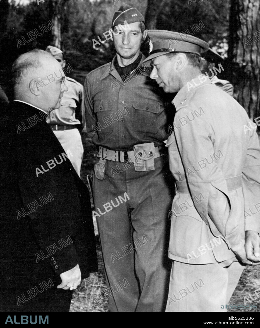 Archbishop Spellman Meets King George: Archbishop Francis J. Spellman of New York, Military Vicar of Catholic Chaplains (left) Greets King George VI of Great Britain (right), while Lt. Gen. Mark W. Clark, Commanding General took place during His Majesty's tour of the Italian Front. February 08, 1944. (Photo by ACME).