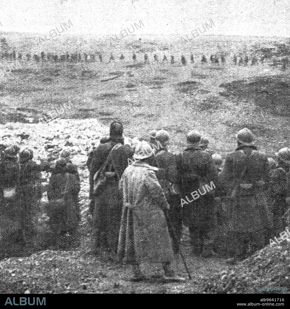 'De l'emplacement de la ferme Thiaumont, les Senegalais regardent defiler les prisonniers allemands, le 24 octobre,a 2 h. de l'apres-midi', 1916. From "Collection de la Guerre IV. L'Illustration Tome CXLVIII. La Guerre Juillet, Aout, Septembre, Octobre, Novembre, Decembre 1916". (From Thiaumont farm, the Senegalese watch German prisoners march past, on October 24, at 2 a.m. of the afternoon).