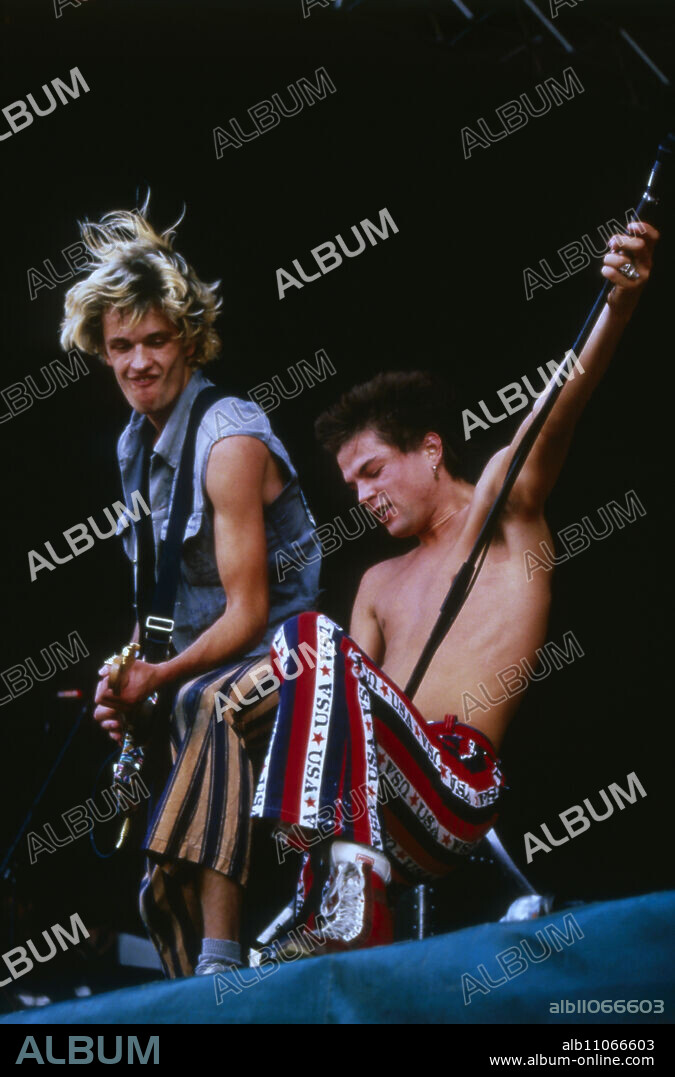 The Toten Hosen, German punk rock band, on stage in Garching near Munich, Olof Palme Festival, 1987, singer Campino, right.