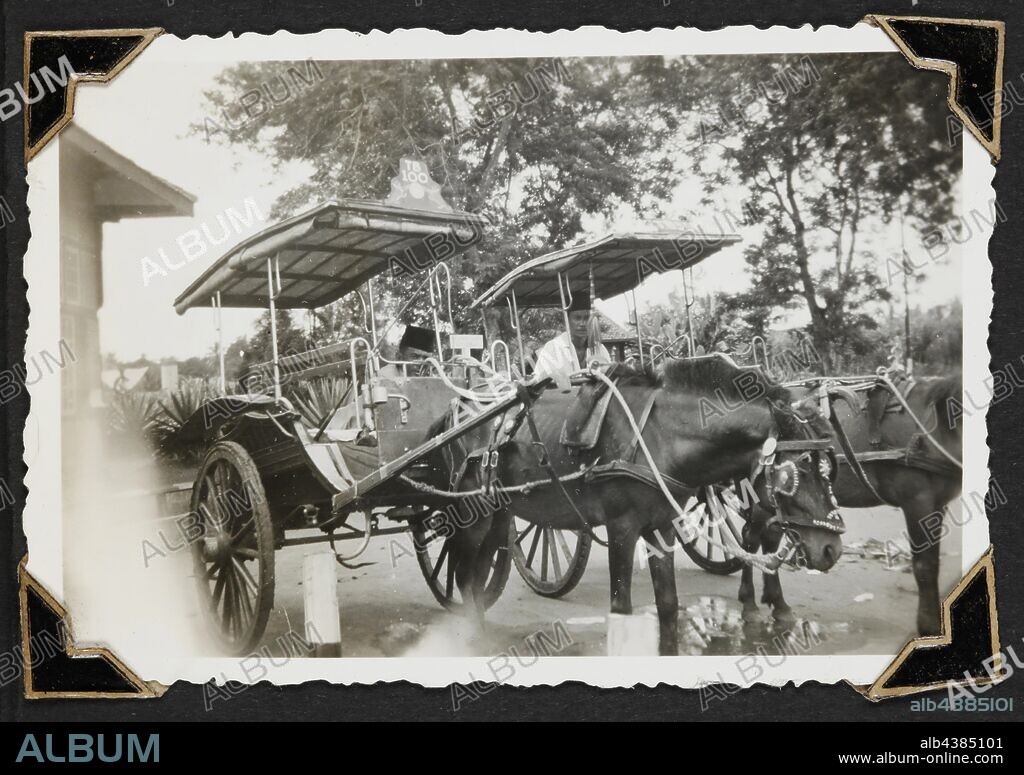 Photograph - 'Cab Rank Tandjoeng Kerang Station', Dutch East Indies, 1942, Black and white photograph of two horse and cab. One of 116 photographs in a photographic album held by Pilot Officer Colin Keon-Cohen. These are very good images of life in Singapore with 205 Sqn RAF, then 77 Sqn RAAF, World War II era.