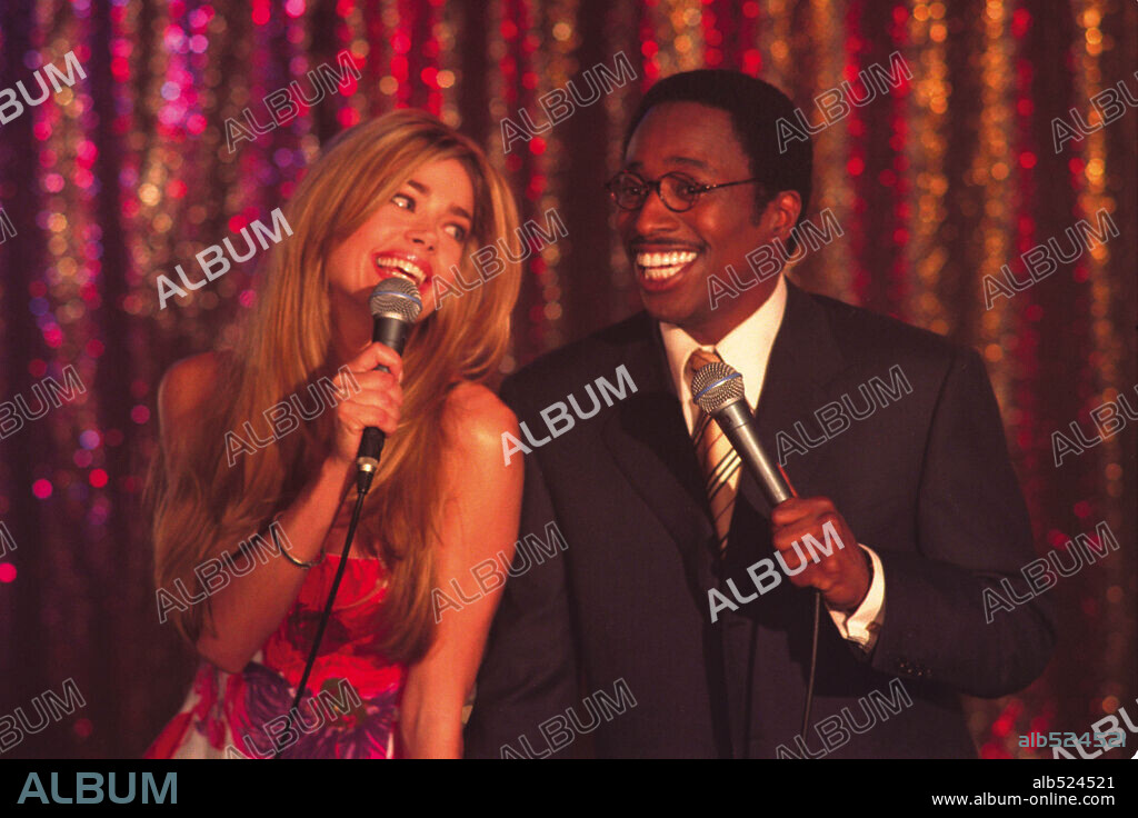 DENISE RICHARDS and EDDIE GRIFFIN in UNDERCOVER BROTHER, 2002, directed by MALCOLM D. LEE. Copyright UNIVERSAL PICTURES.