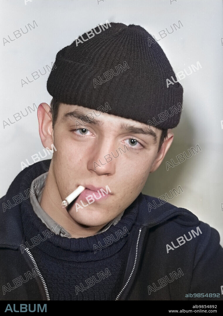 Merchant Seaman smoking a cigarette, head and shoulders portrait, Arthur Rothstein, U.S. Office of War Information, colorized, December 1941.