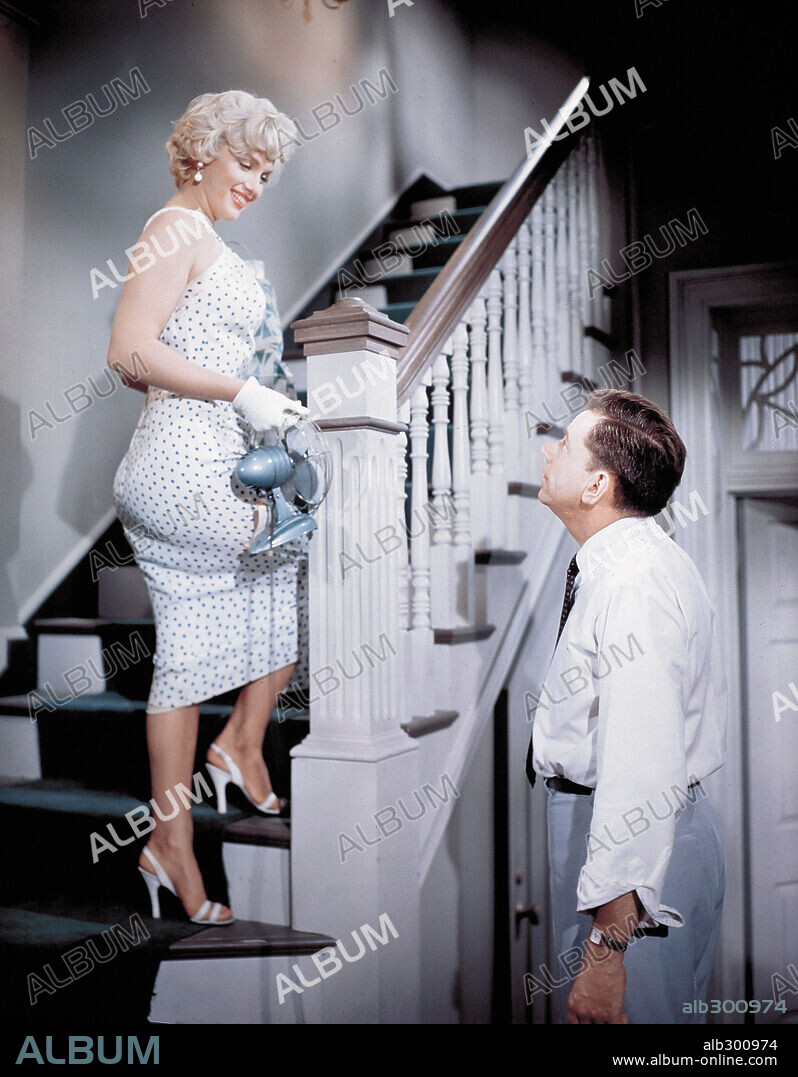 NORMA JEAN BAKER and TOM EWELL. MARILYN MONROE and TOM EWELL in THE SEVEN YEAR ITCH, 1955, directed by BILLY WILDER. Copyright 20TH CENTURY FOX.