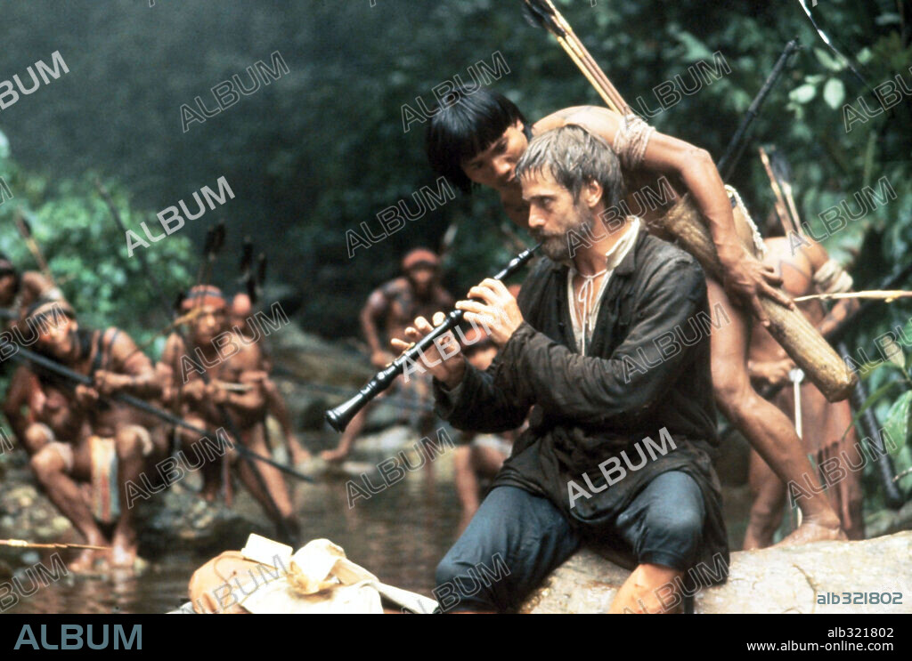 JEREMY IRONS in THE MISSION, 1986, directed by ROLAND JOFFE. Copyright WARNER BROTHERS.