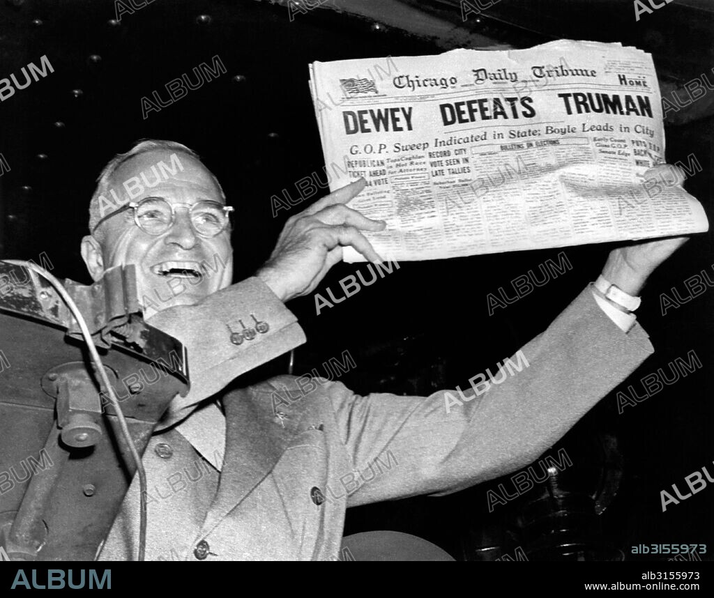 St. Louis, MIssouri: November, 1948. President Harry Truman holds up a copy of the Chicago Daily Tribune declaring his defeat to Thomas Dewey in the presidential election.