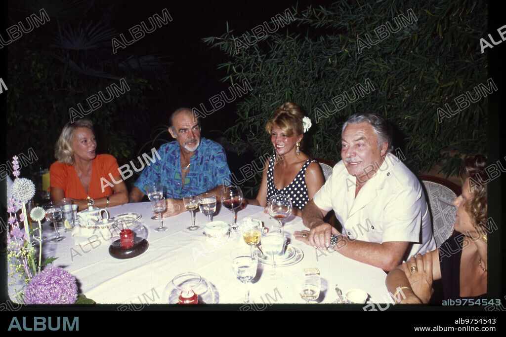 Marbella, 1991 (CA.). Sean Connery, Tita Cervera (Carmen Thyssen) and Alfonso de Hohenlohe at a dinner.