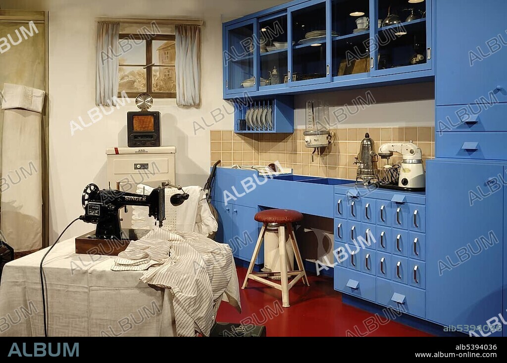 Kitchen from around 1930, an electric sewing machine in front, Museum for Industrial Culture, Aeussere Sulzbacher Strasse 60-62, Nuremberg, Middle Franconia, Bavaria, Germany, Europe.