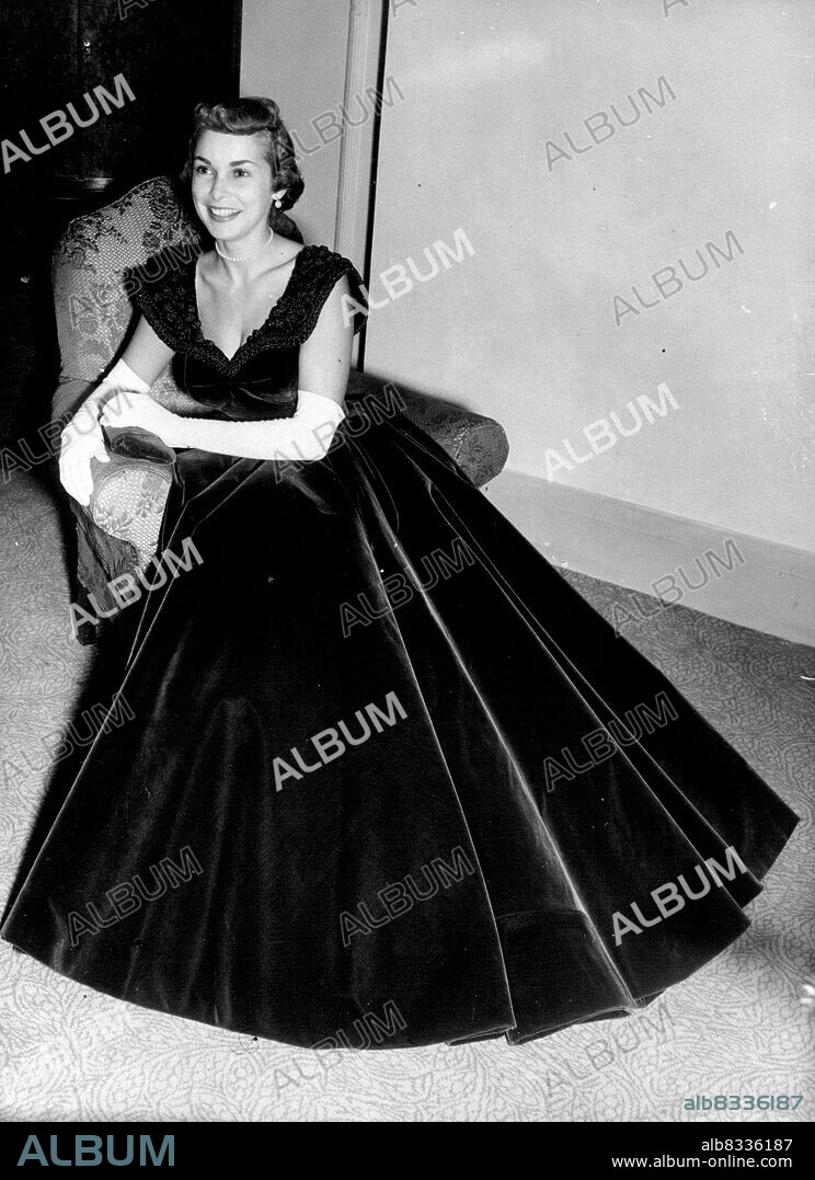 The Duke Entertains The Stars - Janet Leigh at the Washington hotel, curzon street, before she went to the Duke's party at the empress hall. Her ruby velvet dress with embroidered collar was specially designer for her by Don Loper. Miss Leigh had a busy evening because before going to the party she took part in the B.B.C. Programme," in town tonight". Last night H.R.H. The Duke of Edinburgh gave a party fur stars taking part in tomorrow's "Midnight matinee" that will be given in support of the national playing fields association. December 9, 1951. (Photo by Paul Popper Ltd.).
