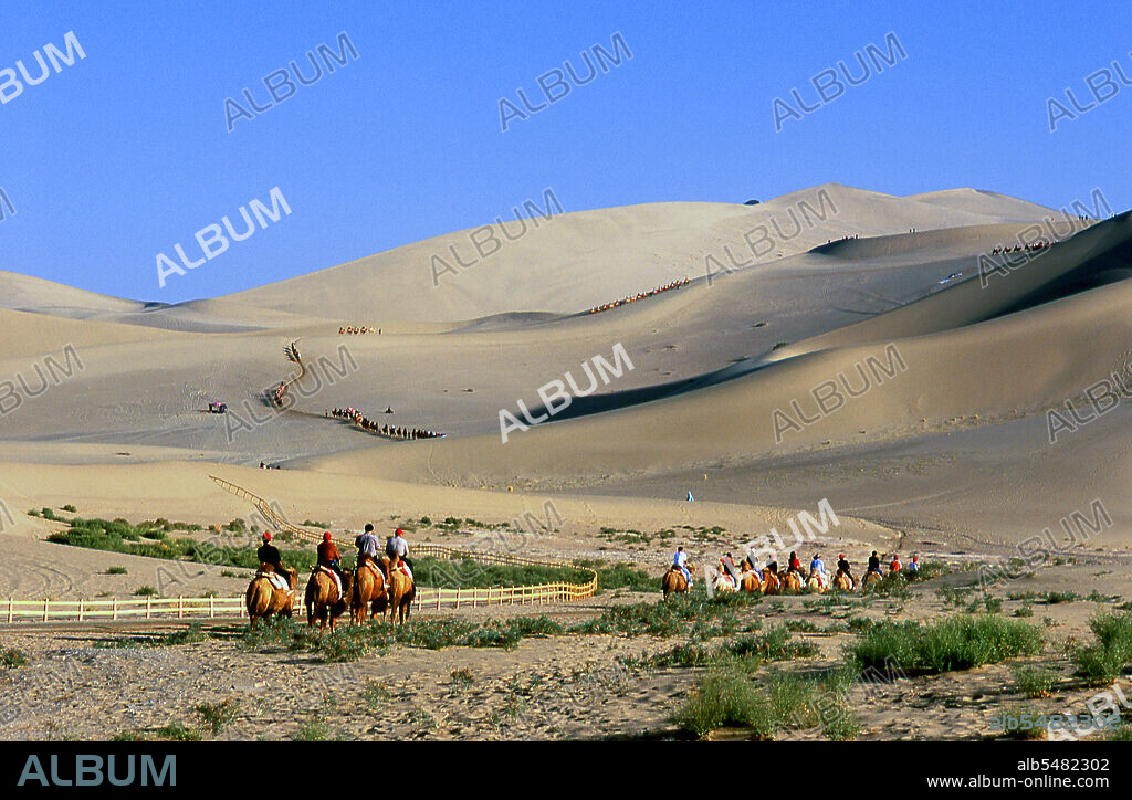 Mingsha Shan (Singing Sand Dunes) are situated about 4km south of Dunhuang. They are the largest and most impressive sand dunes in China. The main dunes rise to between 250m and 300m. They are called ‘Singing Sands’ because the shifting grains of sand make a humming noise in powerful winds. The Kumtagh Desert is a section of the Taklamakan Desert which lies east-southeast of the Desert of Lop.