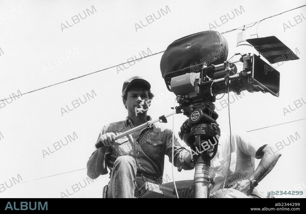 Terence Hill in The World of Don Camillo. Italian actor and director Terence Hill (Mario Girotti) using a camera on the set of the film The World of Don Camillo. 1983.
