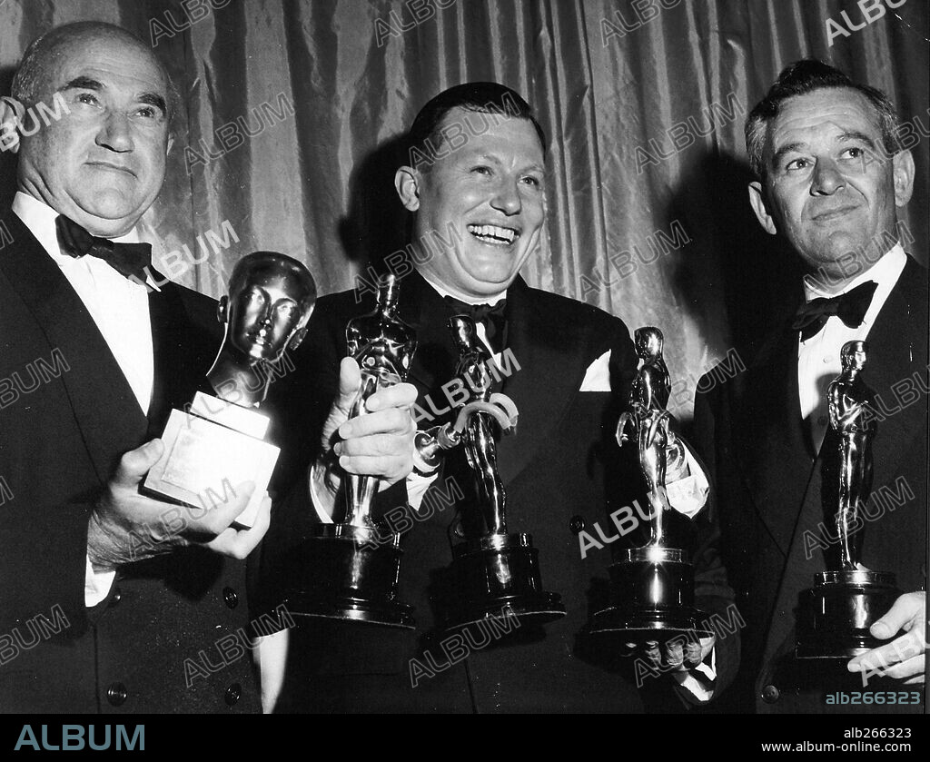 HAROLD RUSSELL, SAMUEL GOLDWYN and WILLIAM WYLER. The 19th Academy Awards / 1947. 
Harold Russell, best actor in a supporting role for "The best Years of Our Lives" and Special Award for bringing hope and courage to his fellow veterans through his appearance in 'The Best Years of Our Lives.' William Wyler, best director for 'The Best Years of Our Lives". Samuel Goldwyn recieves the Irving G.Thalberg award and the best motion picture award for 'The Best Years of Our Lives". 1947