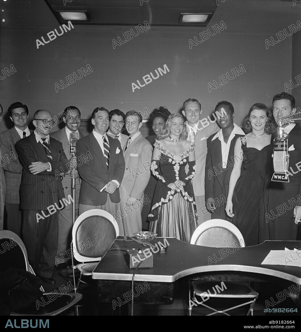 WILLIAM PAUL GOTTLIEB. Portrait of Johnny Desmond, Martin Block, Cab Calloway, Georgie Auld, Mel TormÚ, Mary Lou Williams, Tommy Dorsey, Josh White, Beryl Davis, and Ray McKinley, WMCA, New York, N.Y., ca. Oct. 1947.