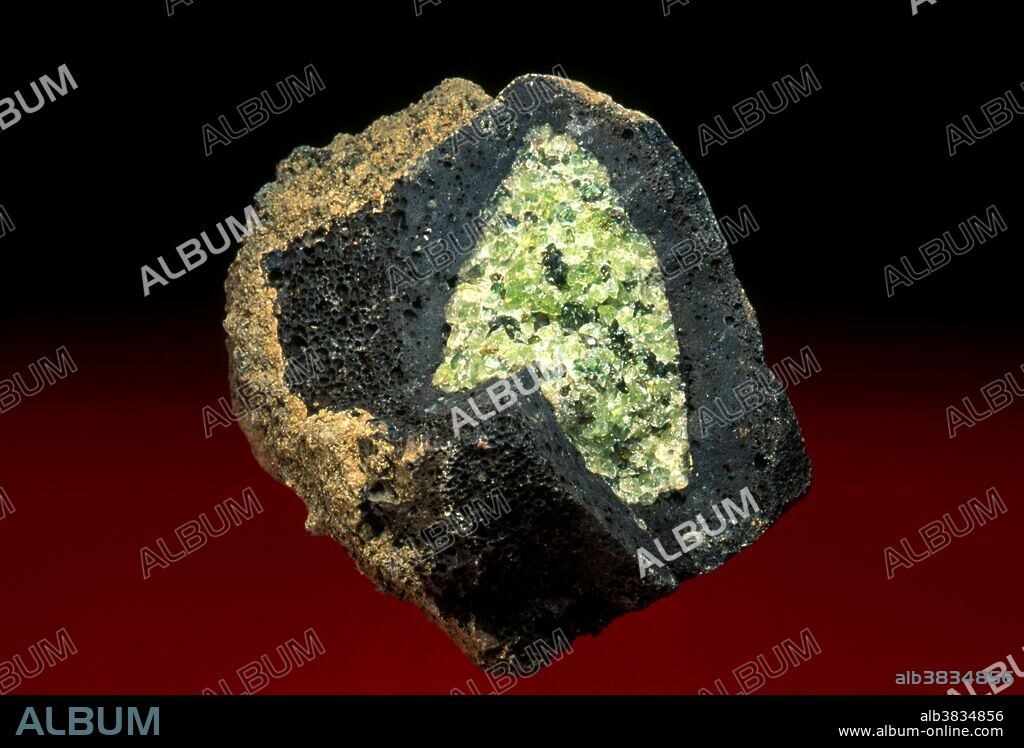 Olivine crystals in a basalt bomb from Spain. Dimensions: 6.5 x 6.5 x 5 cm.