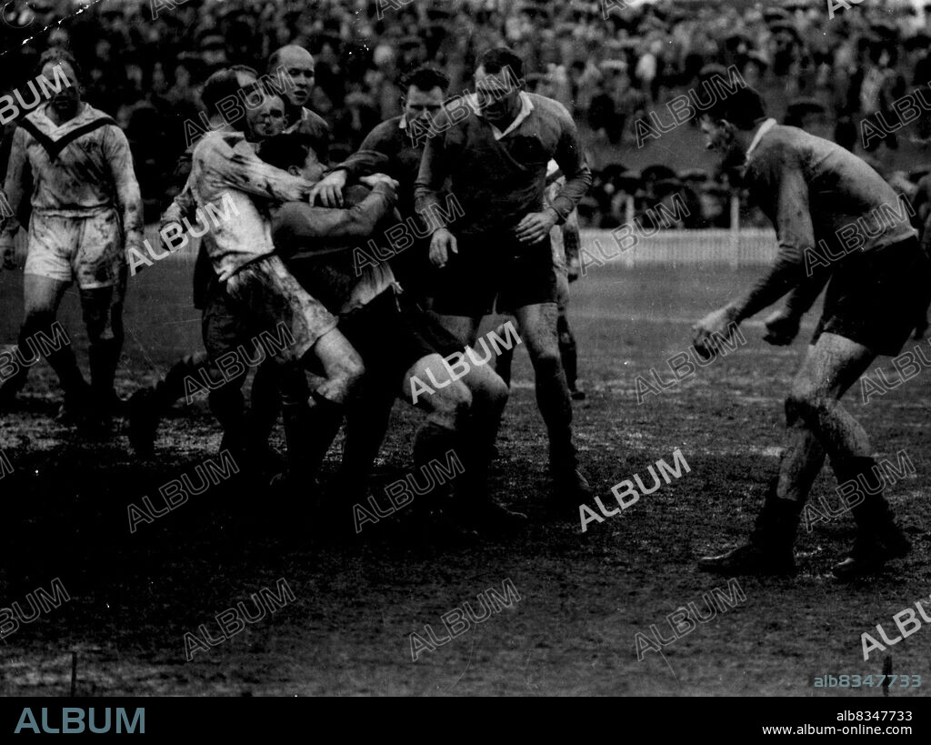 Identification was difficult, but the players, from left to right, are believed to be: Alan Prescott (GB), Charlie Pawsey (GB). Roy Bull, Jim Evans, Peter Diversi, Jack Rayner, Norm Provan.NSW were leading 17-6 just 16 minutes into the second half when referee Aub Oxford abandoned the match.English Pawsey has strangle hold on hooker Kearney in the English-NSW match at SCG last season. The match, later a disgraceful brawl and abandoned, is named by Bull (arrow) as the roughest he has played in.  March  25, 1955.